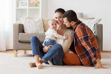 Image showing happy family with baby having fun at home