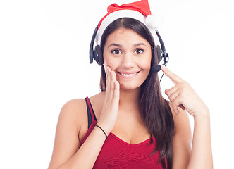 Image showing Christmas headset woman from telemarketing call center wearing red santa hat talking smiling isolated on white background.