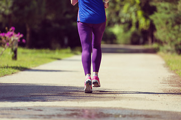 Image showing young female runner training for marathon