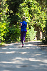 Image showing young female runner training for marathon