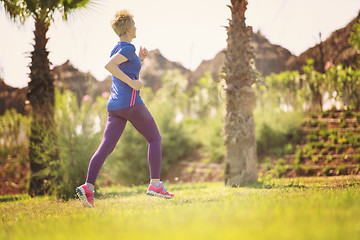 Image showing young female runner training for marathon