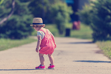 Image showing little girl runing in the summer Park