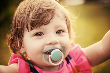 Image showing little girl spending time at backyard