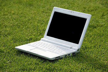 Image showing white laptop in nature