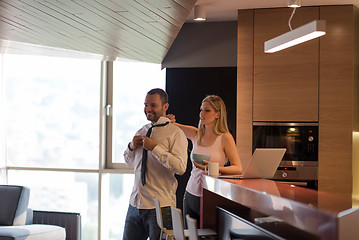 Image showing A young couple is preparing for a job and using a laptop