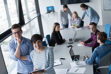 Image showing Two Business People Working With Tablet in office