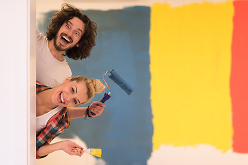 Image showing portrait of a couple painting interior wall