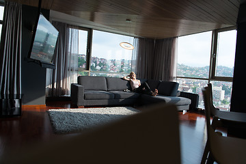 Image showing woman using tablet in beautiful apartment