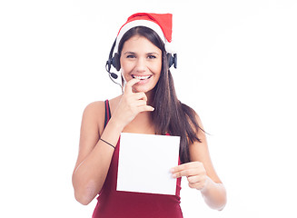 Image showing Christmas phone operator woman showing blank signboard