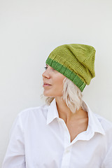 Image showing Beautiful young woman in warm green beanie.