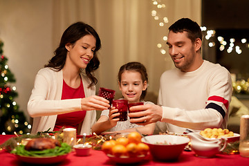 Image showing happy family having christmas dinner at home