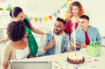 Image showing office team greeting colleague at birthday party