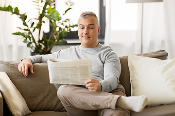 Image showing man reading newspaper at home