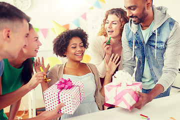 Image showing team greeting colleague at office birthday party