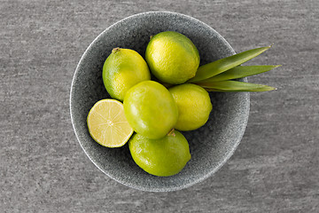 Image showing close up of whole limes in bowl