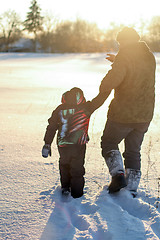 Image showing Happy boy grandpa have winter fun