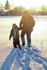 Image showing Happy boy grandpa have winter fun