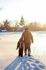 Image showing Happy boy grandpa have winter fun