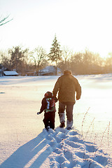 Image showing Happy boy grandpa have winter fun