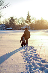 Image showing Happy boy grandpa have winter fun