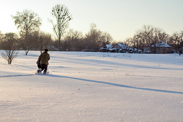 Image showing Happy boy grandpa have winter fun