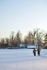 Image showing Happy boy grandpa have winter fun