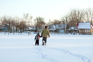 Image showing Happy boy grandpa have winter fun