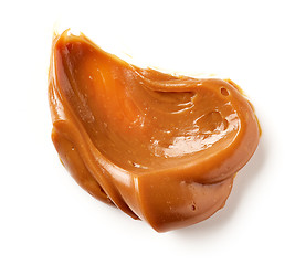 Image showing melted caramel on a white background