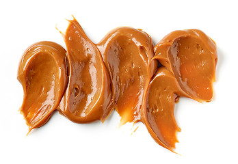 Image showing melted caramel on a white background