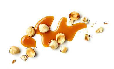 Image showing hazelnuts and caramel sauce