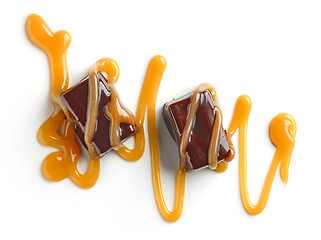 Image showing chocolate candies and caramel sauce