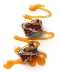 Image showing chocolate candies and caramel sauce