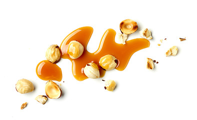 Image showing hazelnuts and caramel sauce