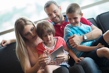 Image showing happy young couple spending time with kids