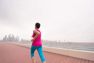 Image showing woman running on the promenade