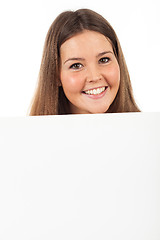 Image showing Beautiful young woman showing blank signboard