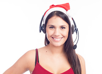 Image showing Christmas headset woman from telemarketing call center wearing red santa hat talking smiling isolated on white background.