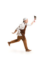 Image showing Smiling butcher posing with a cleaver isolated on white background