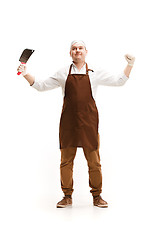 Image showing Smiling butcher posing with a cleaver isolated on white background