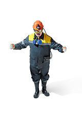 Image showing The studio shot of senior bearded male miner standing at the camera on a white background.