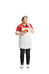 Image showing Portrait of cute smiling woman with pastries in her hands in the studio, isolated on white background