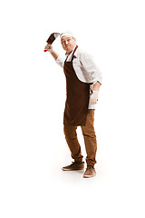 Image showing Angry aggressive butcher posing with a cleaver isolated on white background