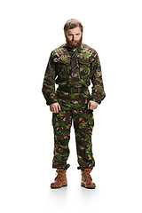 Image showing Young army soldier wearing camouflage uniform isolated on white