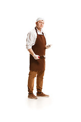 Image showing Serious butcher posing with a cleaver isolated on white background