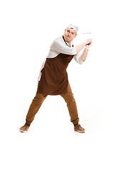 Image showing Angry aggressive butcher posing with a cleaver isolated on white background