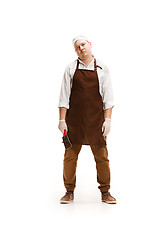 Image showing Bored butcher posing with a cleaver isolated on white background