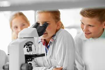 Image showing kids or students with microscope biology at school