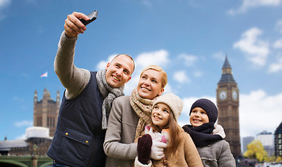 Image showing family taking selfie by smartphone in london city