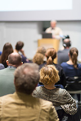 Image showing Man giving presentation in lecture hall at university.