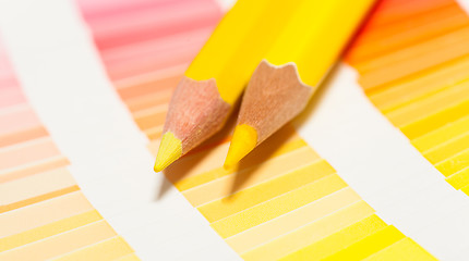 Image showing yellow colored pencils and color chart of all colors